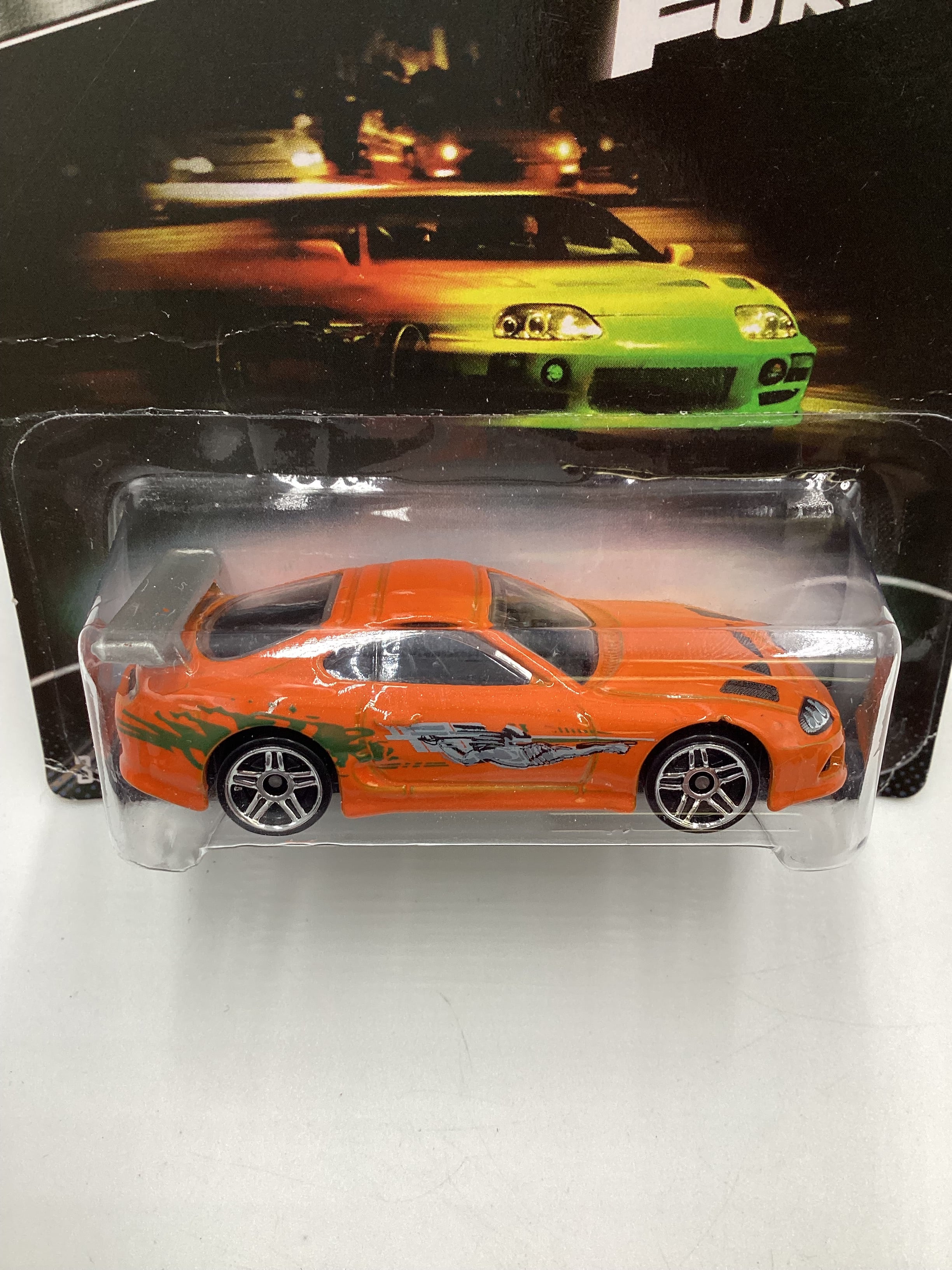 2014 Hot Wheels Fast & Furious #2 Toyota Supra Orange with Silver Wing and protector - Image 3