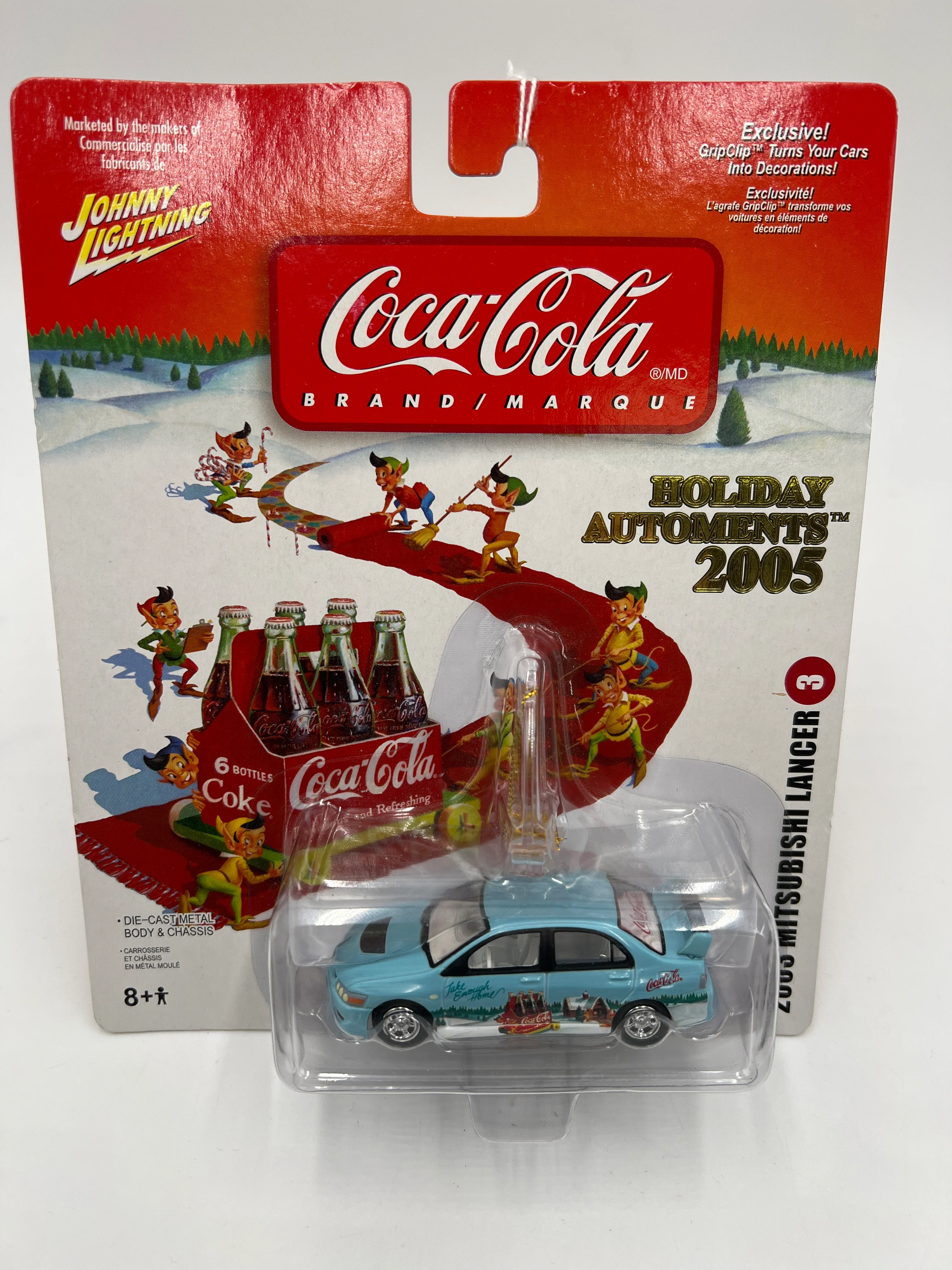 2005 Johnny Lightning Holiday Automents #3 2003 Mitsubishi Lancer Light Blue 228A - Image 2