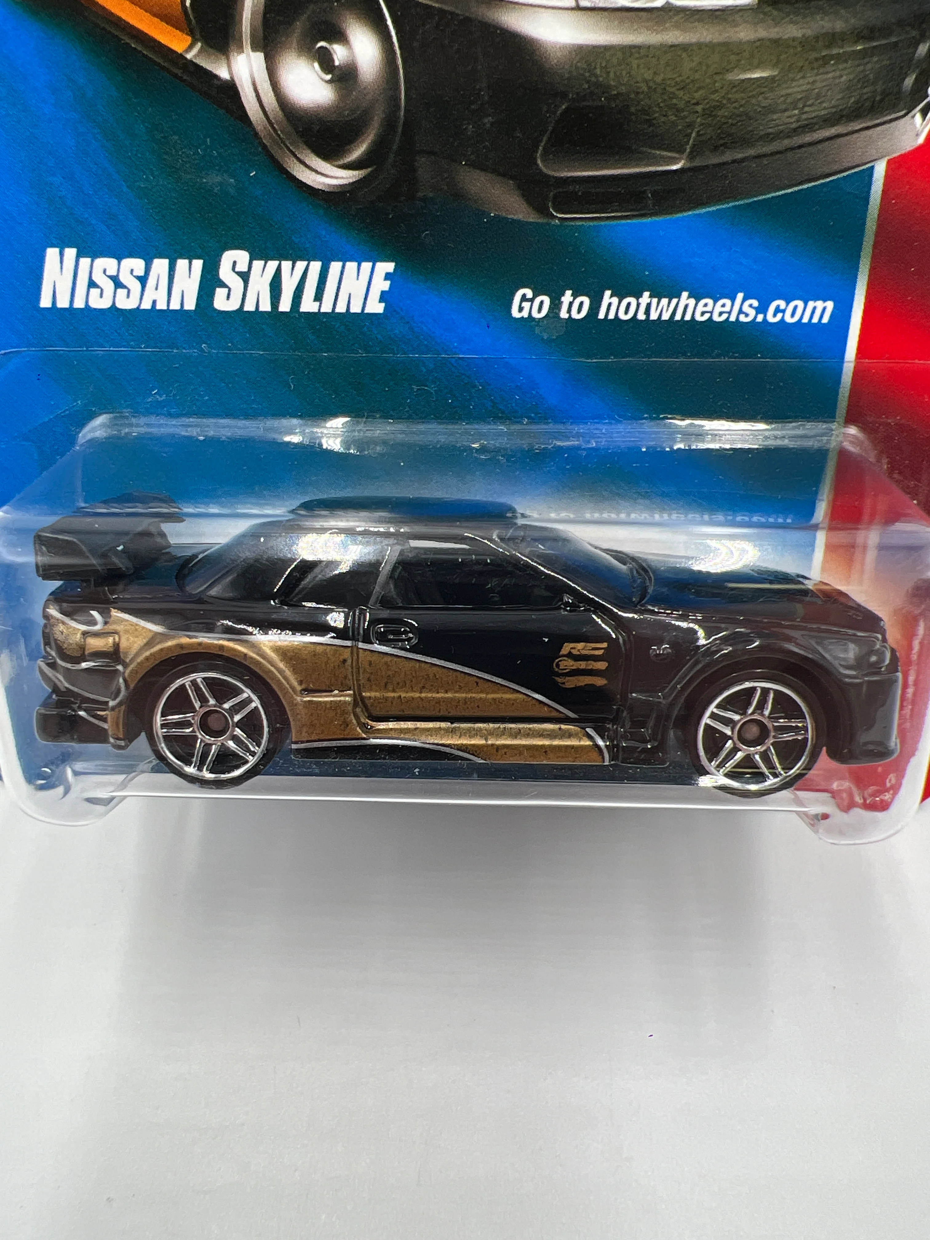 2008 Hot Wheels Web Trading Cars #81 Nissan Skyline Black/Gold W/Protector - Image 3