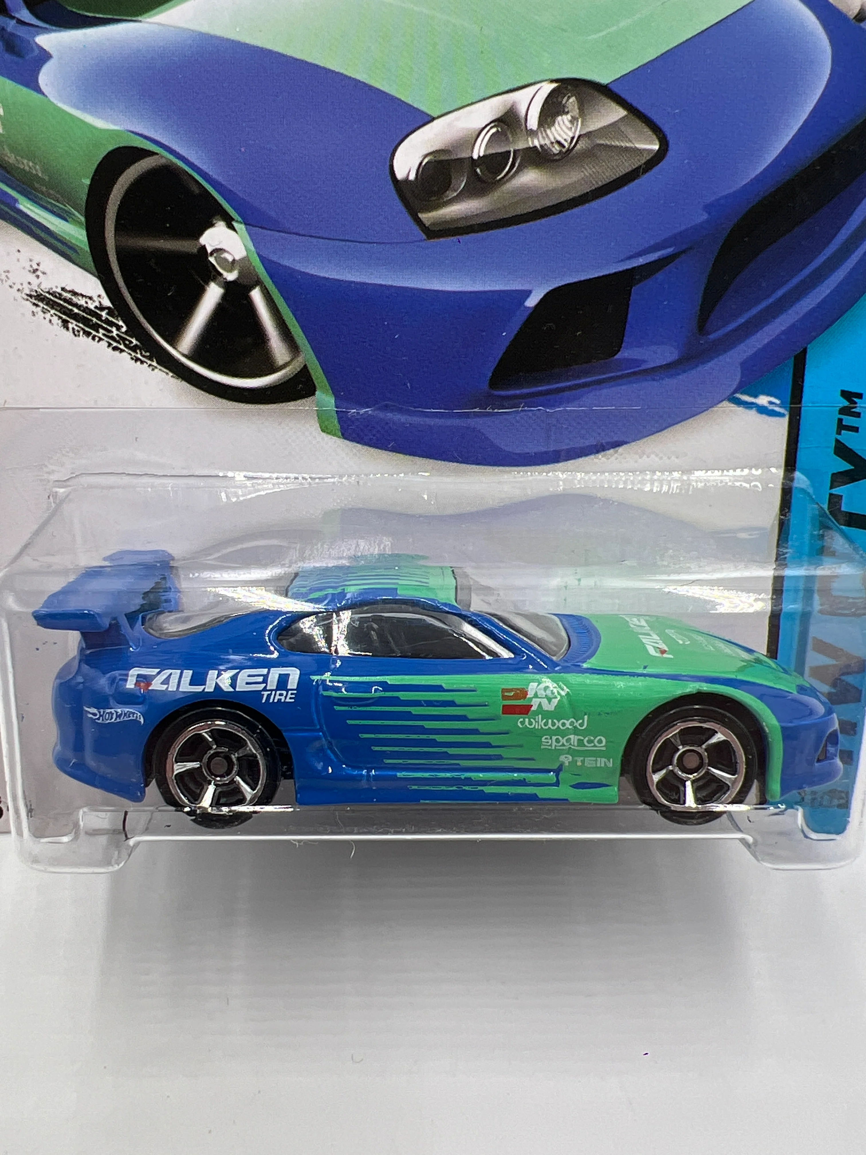 2014 Hot Wheels City #22 Toyota Supra Falken Blue/Green W/Protector - Image 2