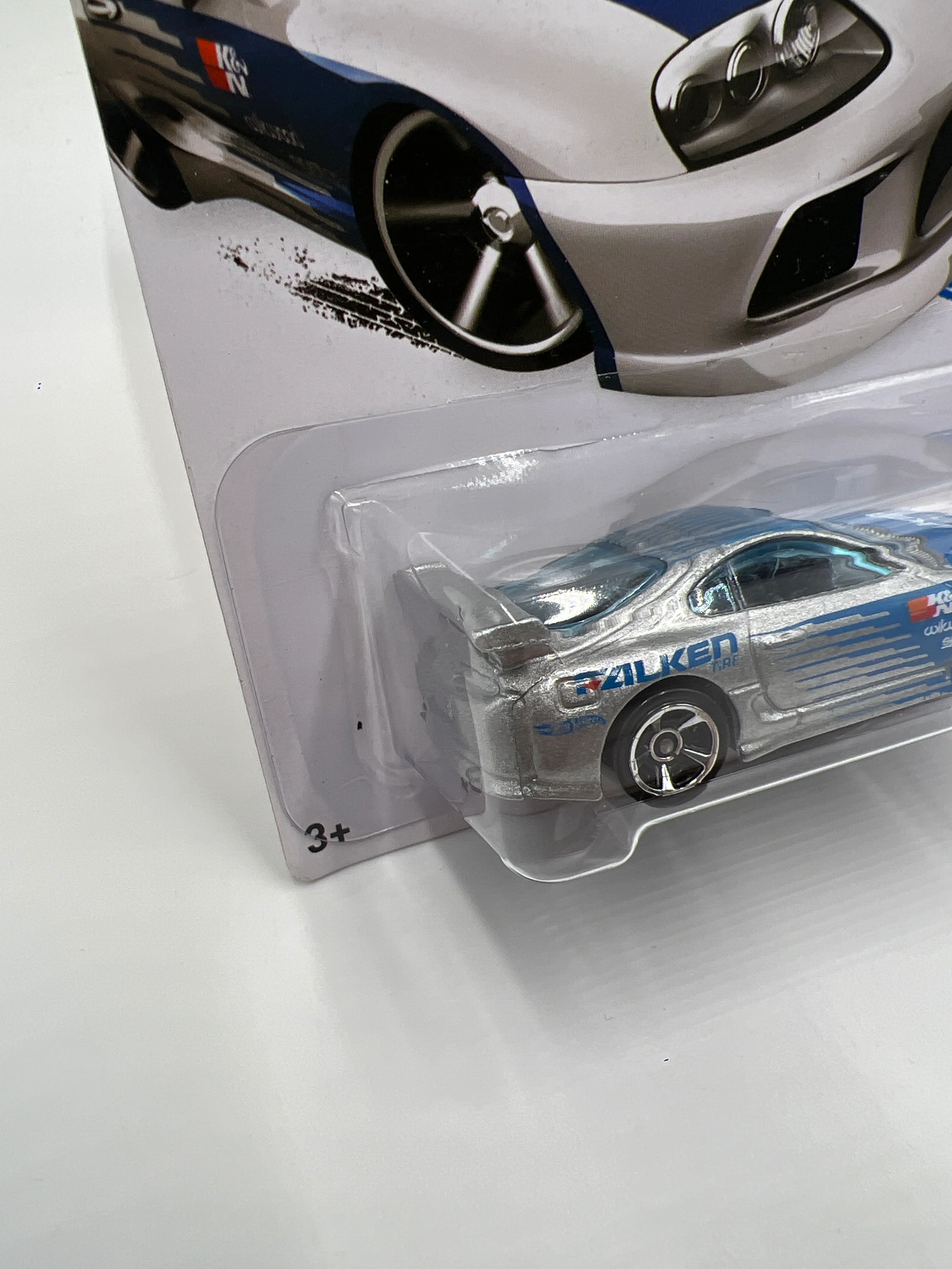 2015 Hot Wheels Kmart Exclusive #22 Toyota Supra Silver Falken W/Protector - Image 4