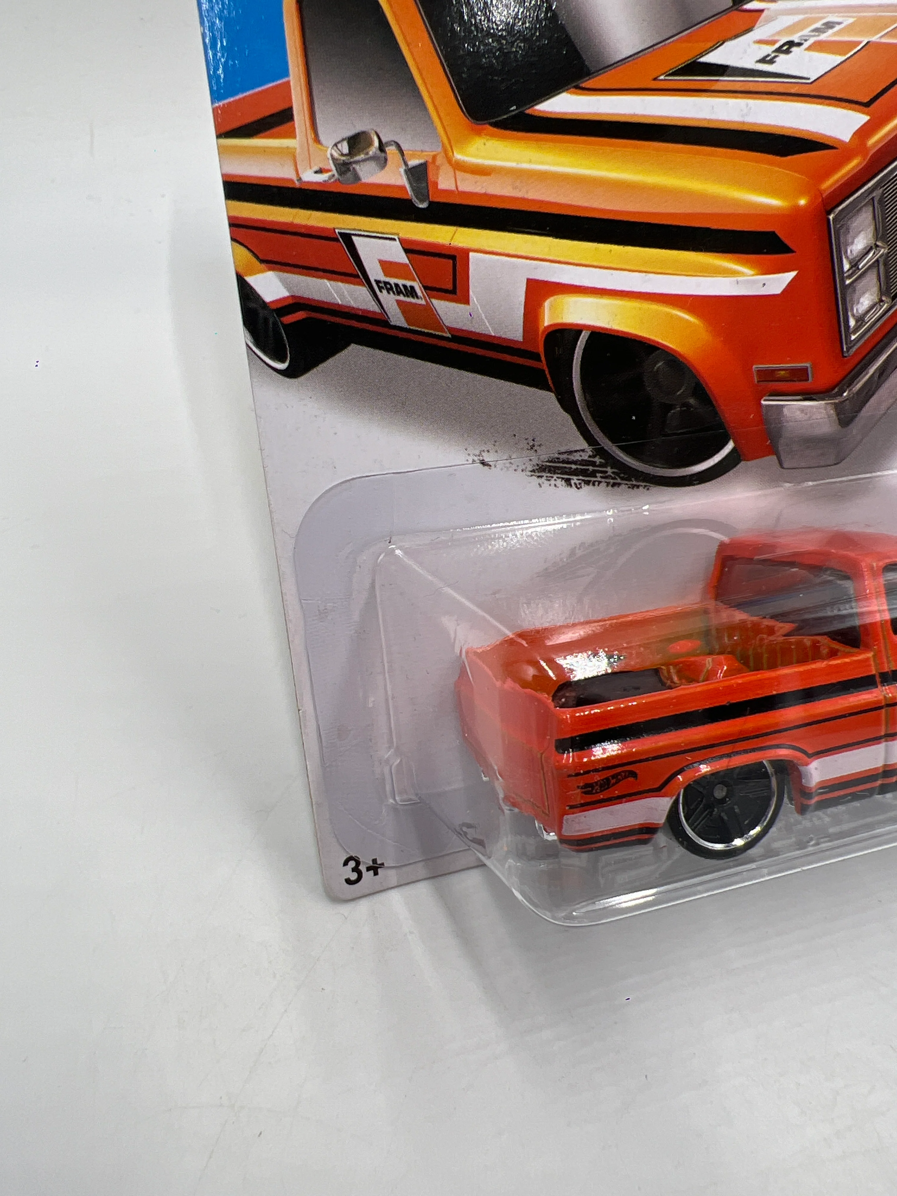 2015 Hot Wheels City #16 83 Chevy Silverado Fram Orange W/Protector - Image 4