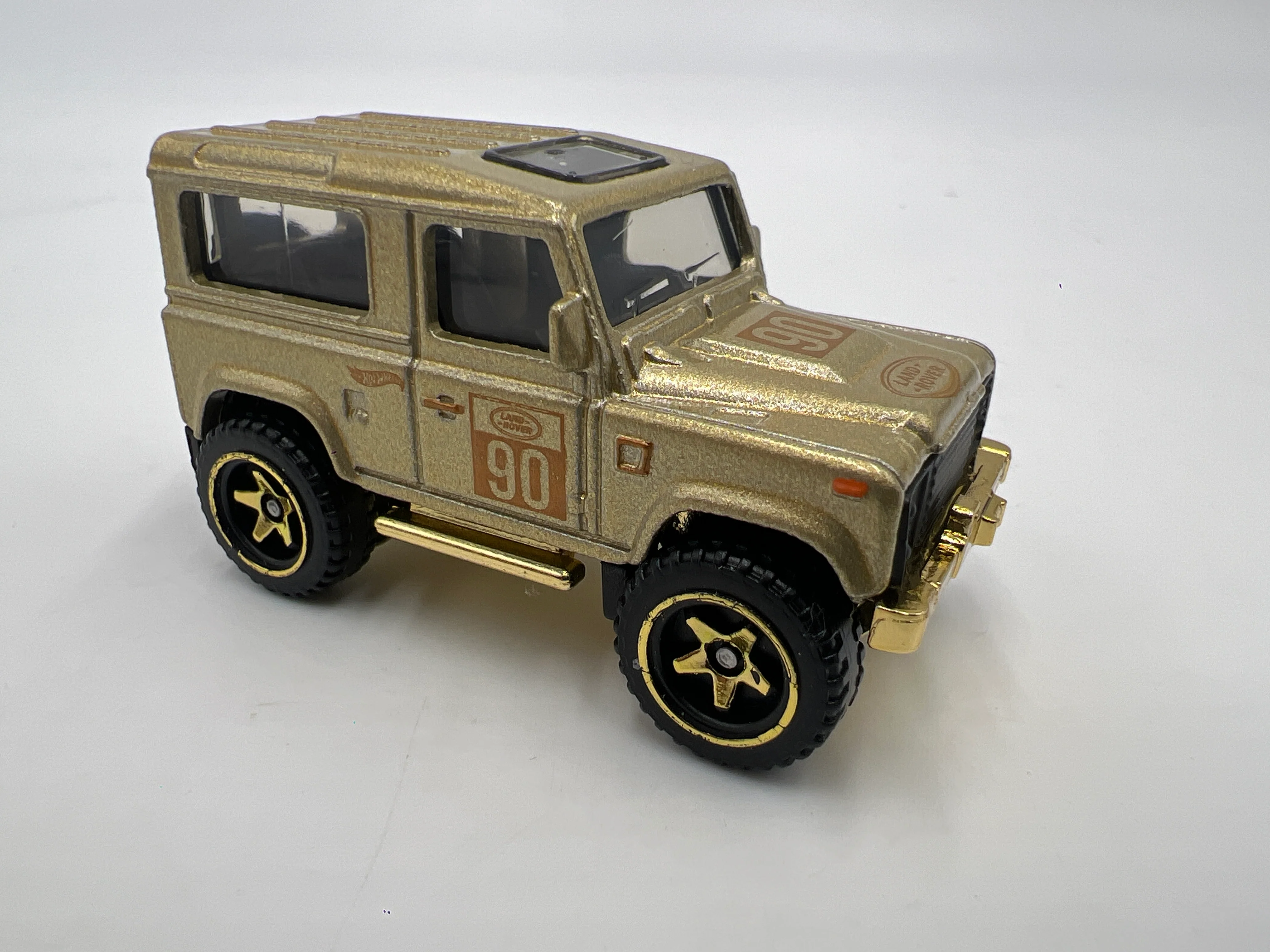 2022 Hot Wheels FAO Schwarz Loose Land Rover Defender 90 Gold - Image 2
