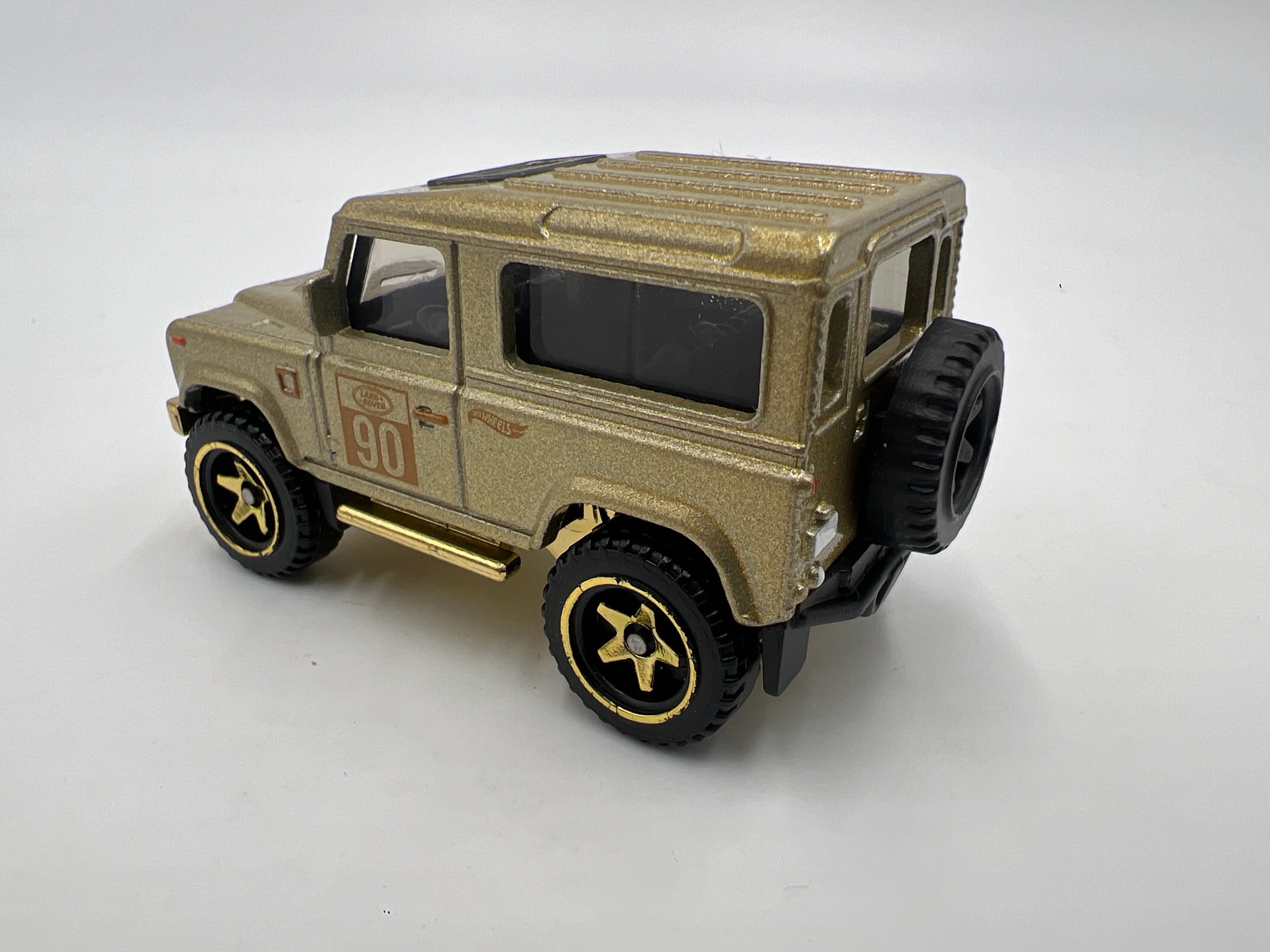 2022 Hot Wheels FAO Schwarz Loose Land Rover Defender 90 Gold - Image 3