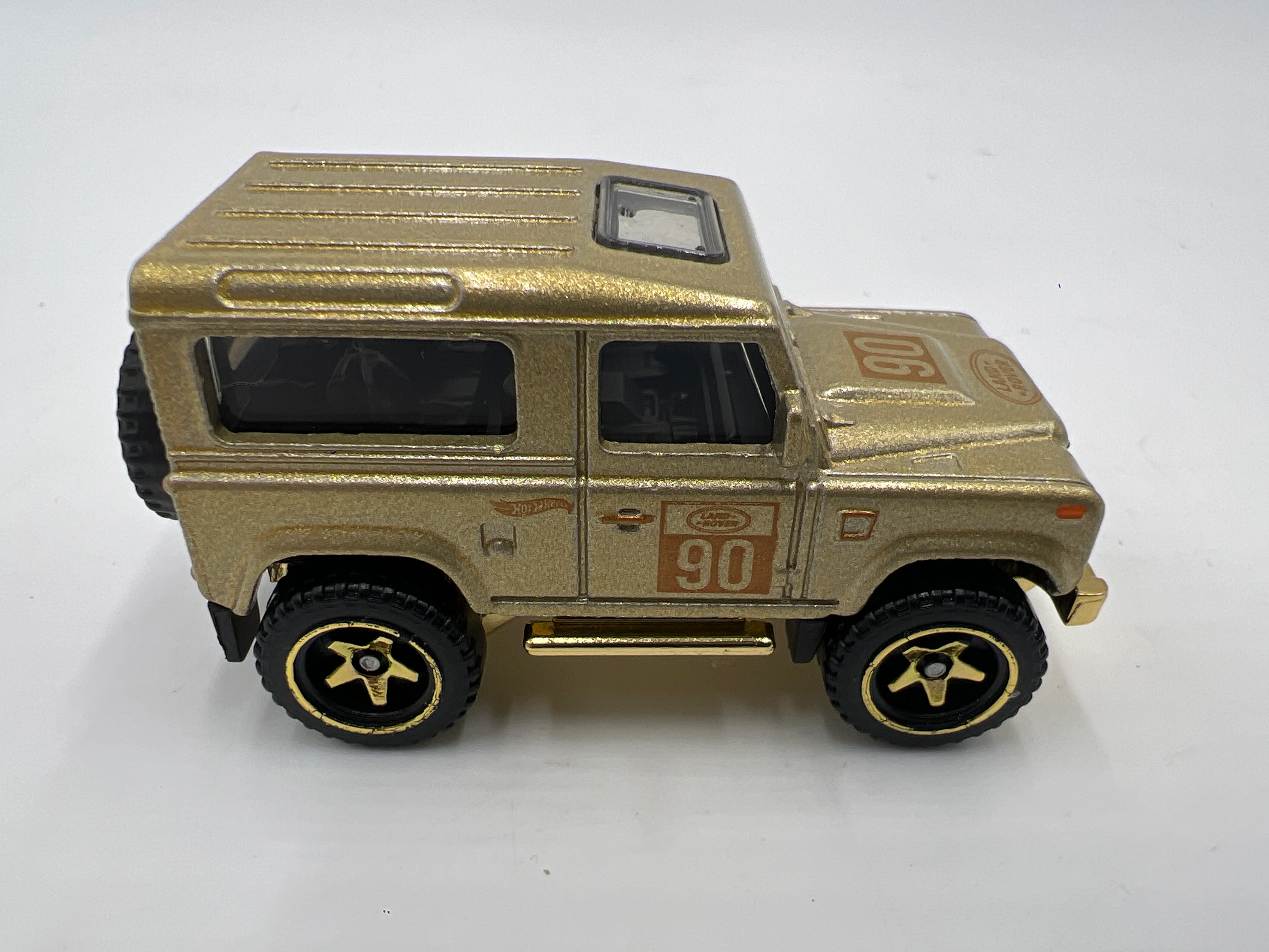 2022 Hot Wheels FAO Schwarz Loose Land Rover Defender 90 Gold - Image 4