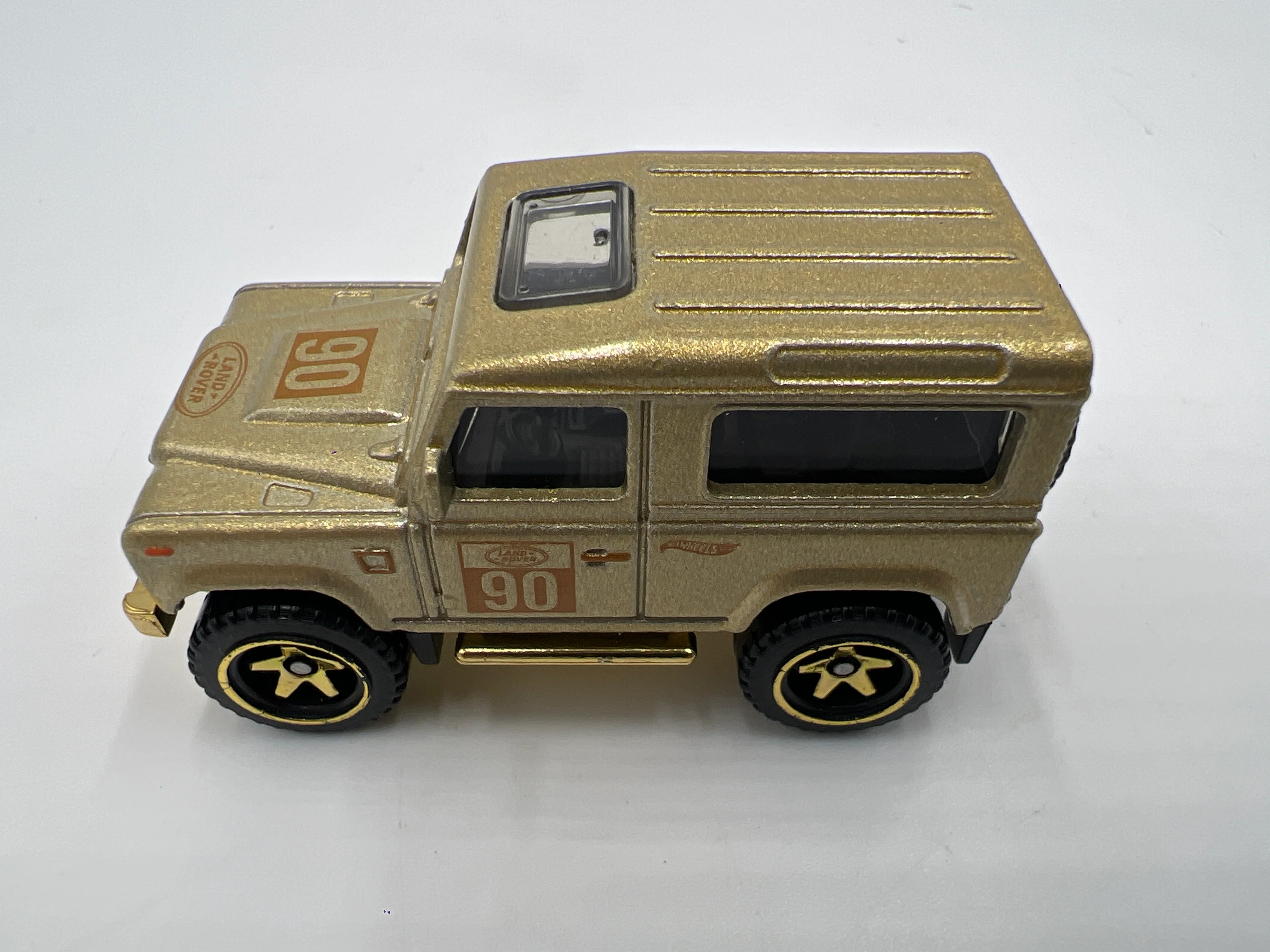 2022 Hot Wheels FAO Schwarz Loose Land Rover Defender 90 Gold - Image 5