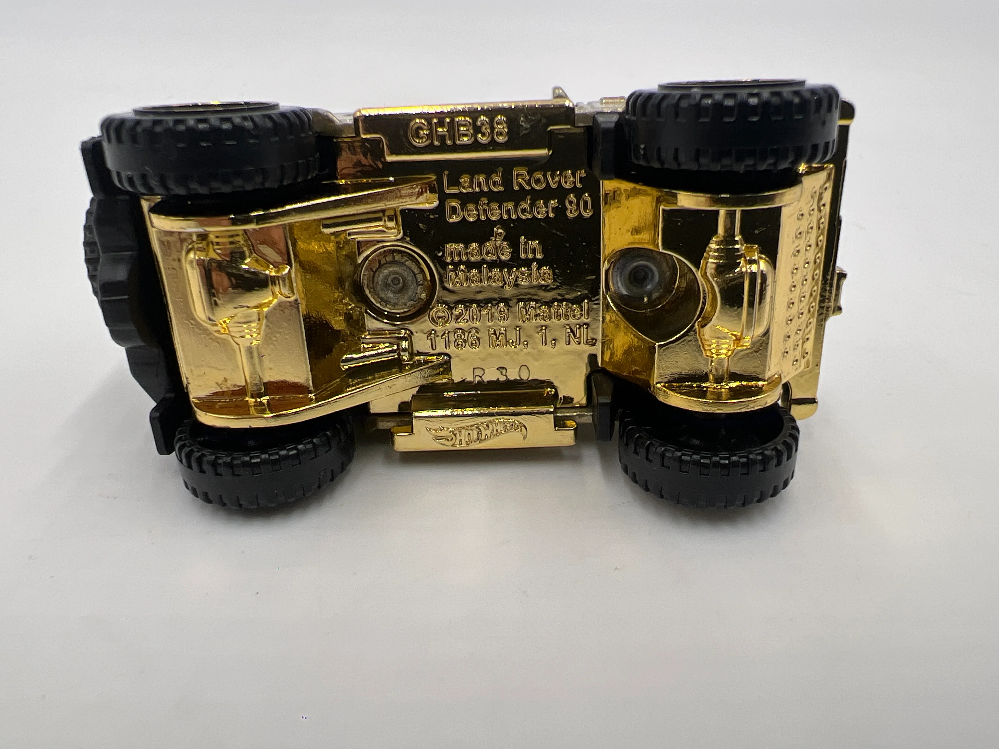 2022 Hot Wheels FAO Schwarz Loose Land Rover Defender 90 Gold - Image 6