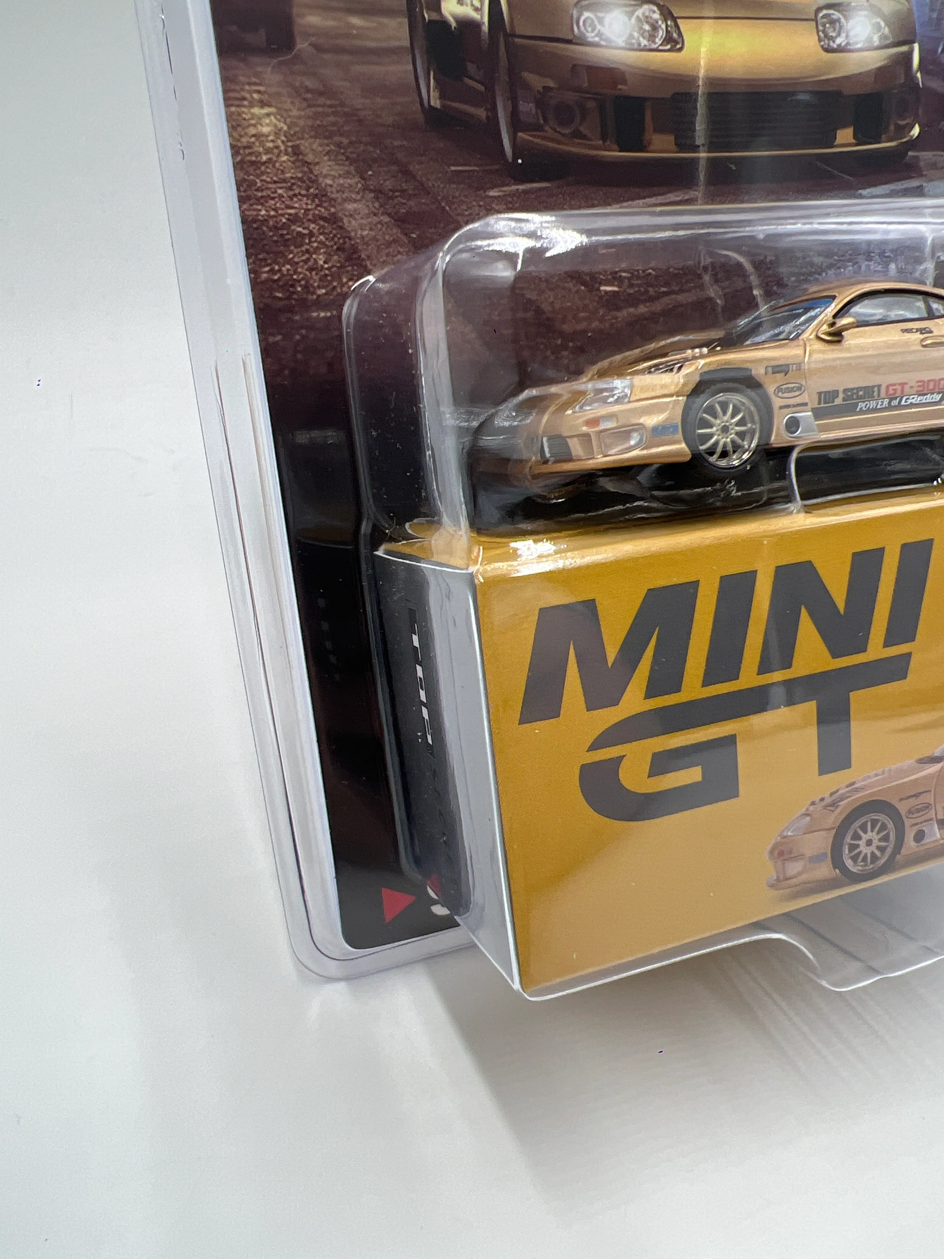 Mini GT #961 Top Secret Toyota Supra A80 GT-300 Gold - Image 4