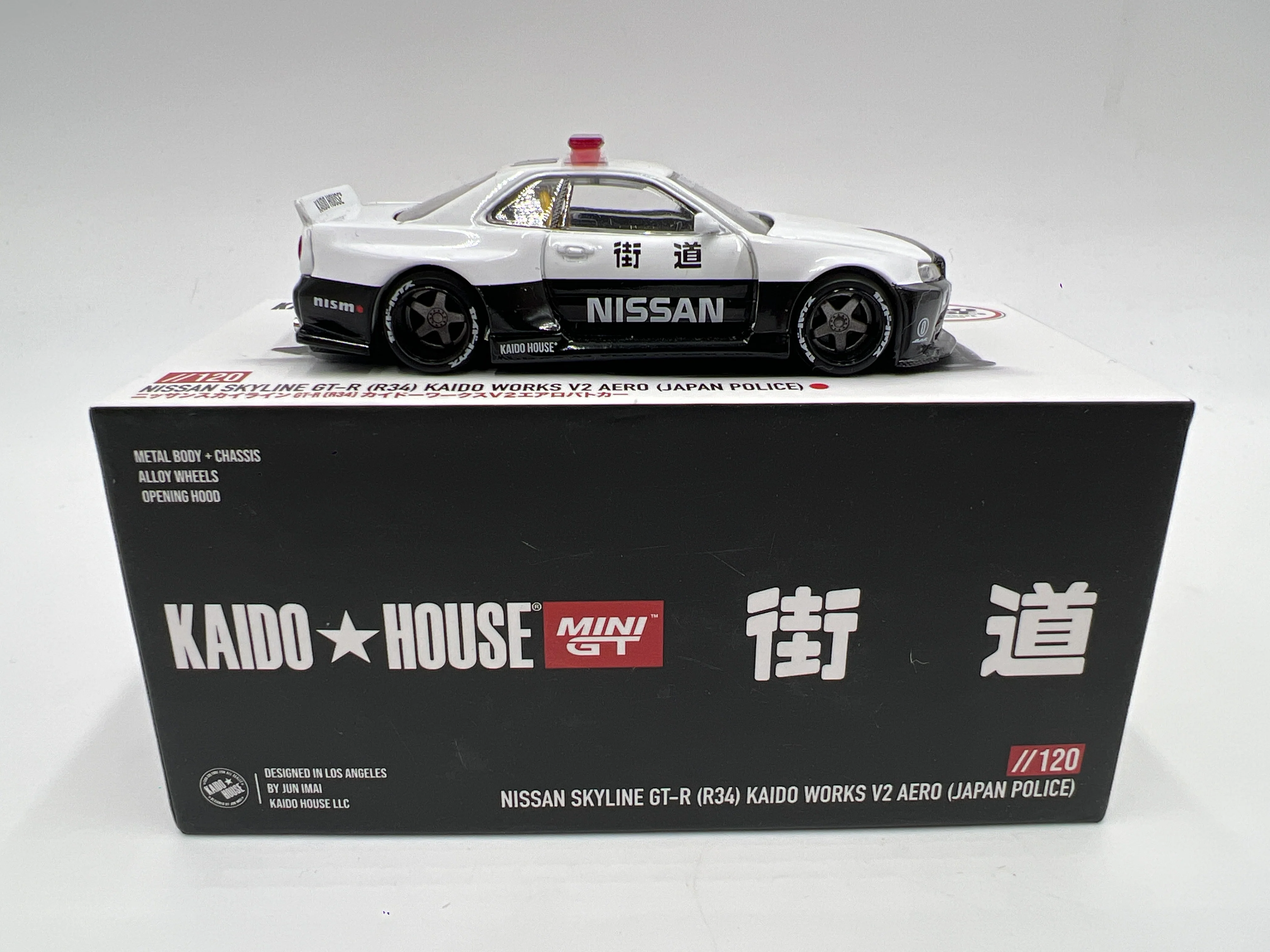Mini GT x Kaido House #120 Nissan Skyline GT-R R34 Kaido Works V2 Aero Japan Police