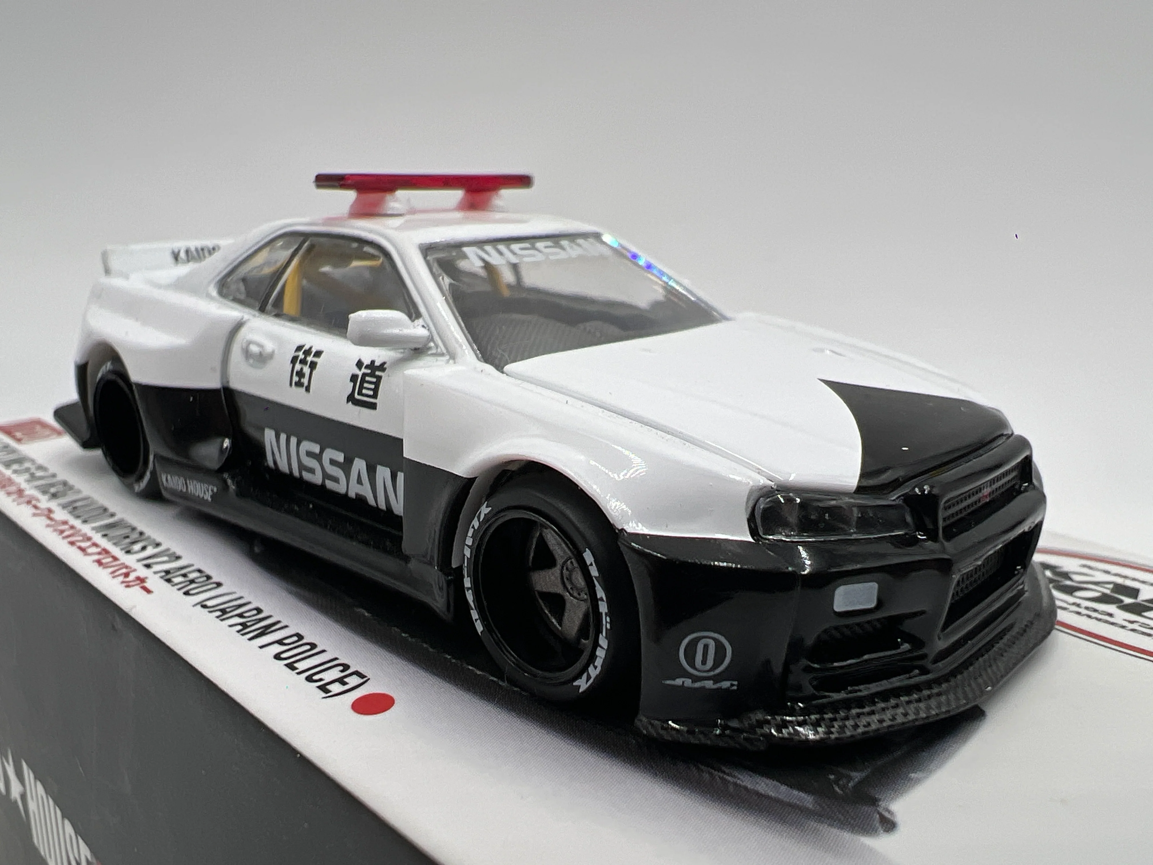 Mini GT x Kaido House #120 Nissan Skyline GT-R R34 Kaido Works V2 Aero Japan Police - Image 2